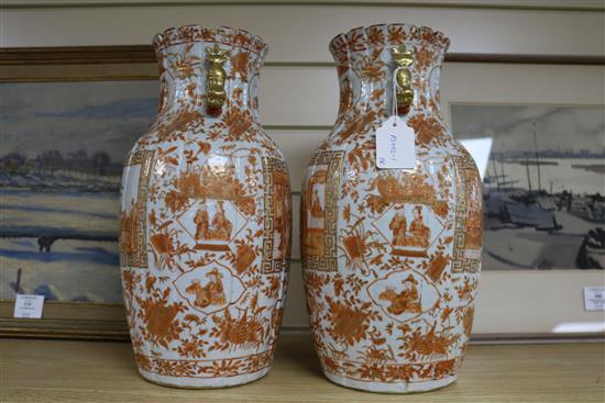 A pair of Chinese iron red and gilt porcelain vases, 19th century mounted as lamps